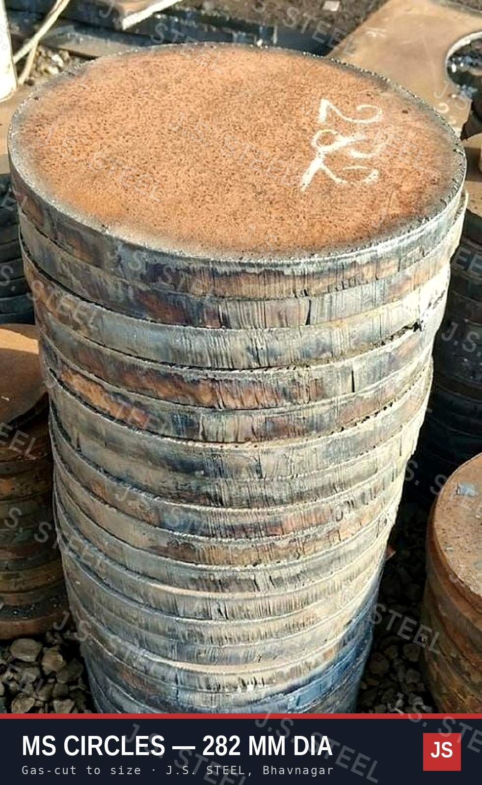 Stack of gas-cut MS circles, 282 mm diameter, marked 282 in chalk, at the J.S. STEEL yard, Bhavnagar