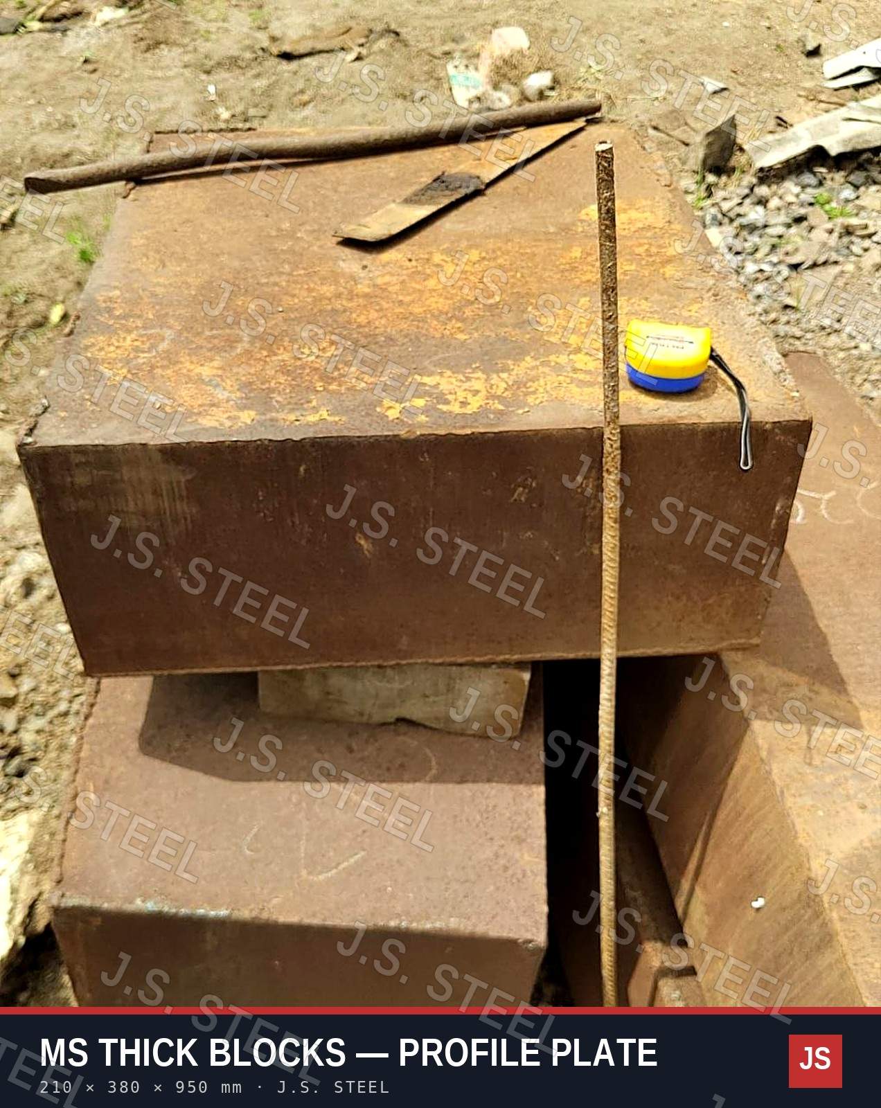 Thick ex-ship MS blocks, 210 × 380 × 950 mm, with a measuring tape for scale at the J.S. STEEL yard, Bhavnagar